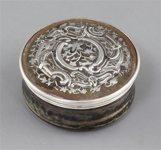 A 19th century continental silver inlaid tortoiseshell circular box and cover, dia.72mm.